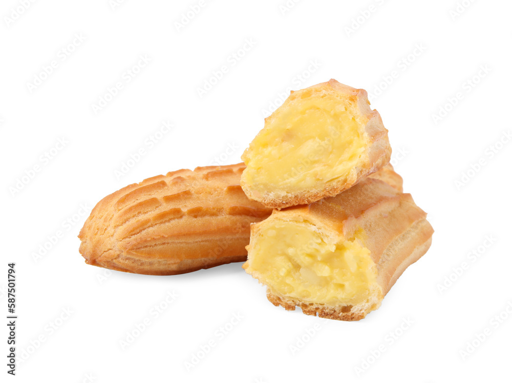 Cut and whole fresh delicious eclairs isolated on white Cut and whole fresh delicious eclairs isolated on white