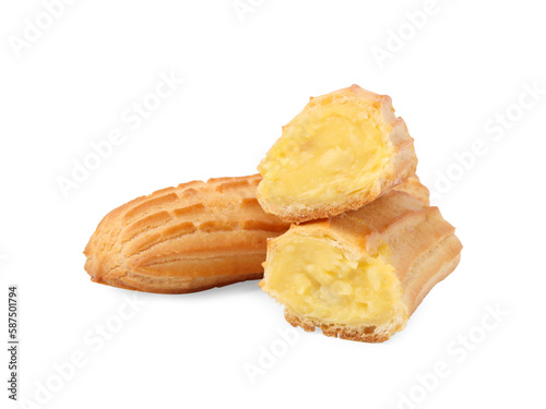 Cut and whole fresh delicious eclairs isolated on white