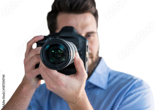 Male photographer photographing through camera