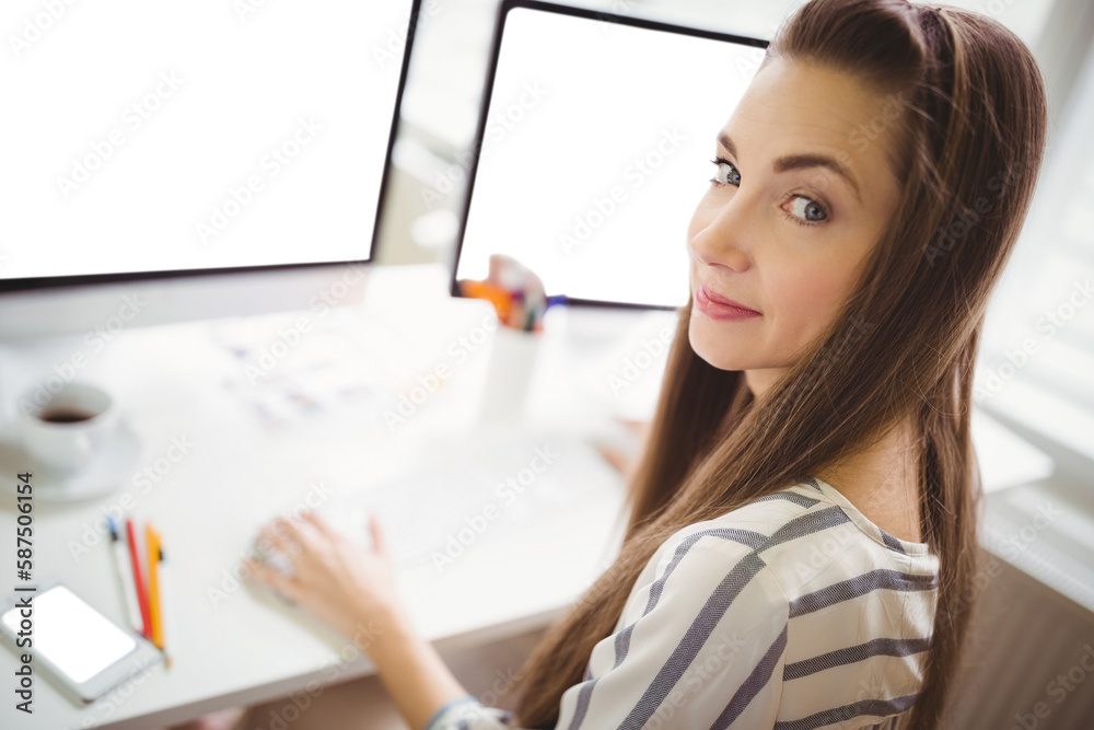 Portrait of woman using computer Portrait of woman using computer