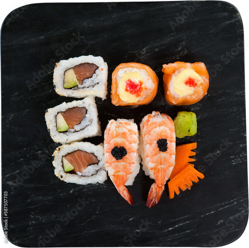 Overhead view of sushi and seafood served in black plate