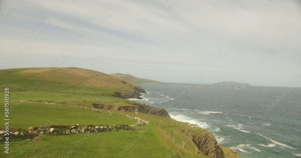 Idyllic view of landscape by ocean