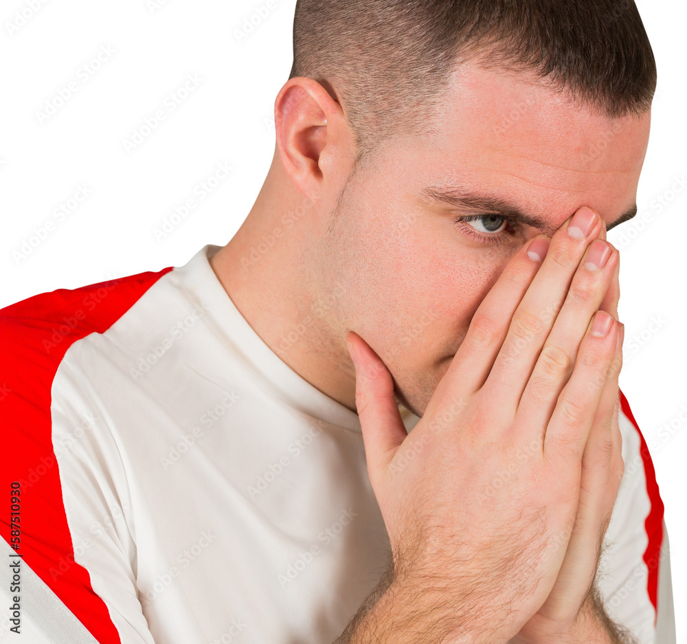 Disappointed football player looking down Disappointed football player looking down