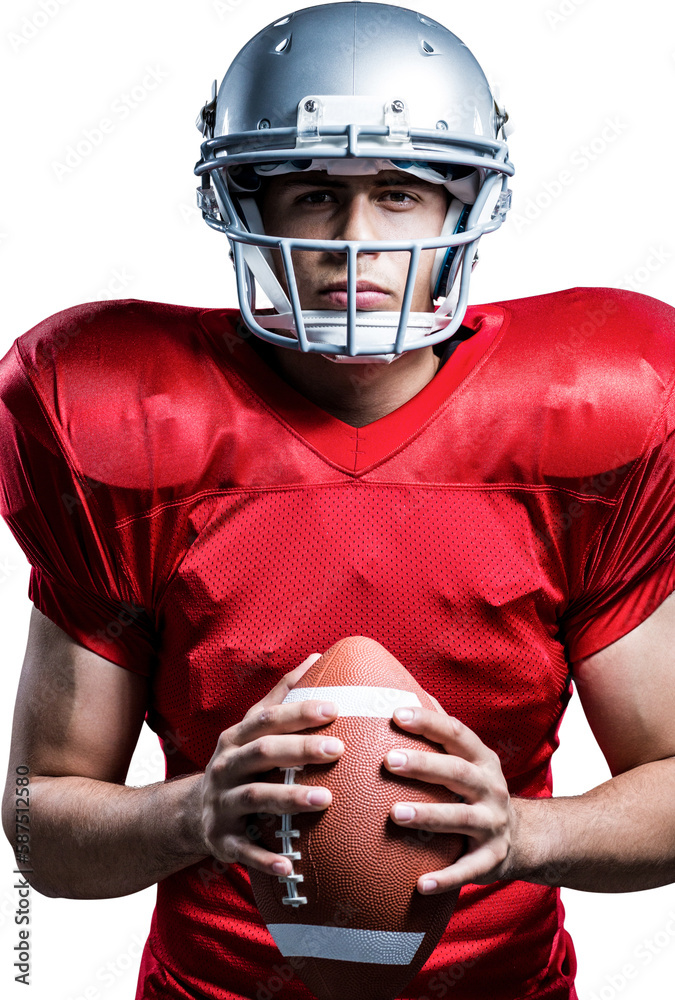 Portrait of serious American football player holding ball