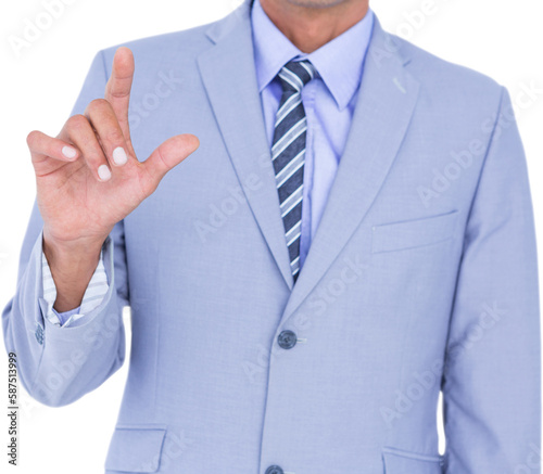 Midsection of businessman touching invisible screen