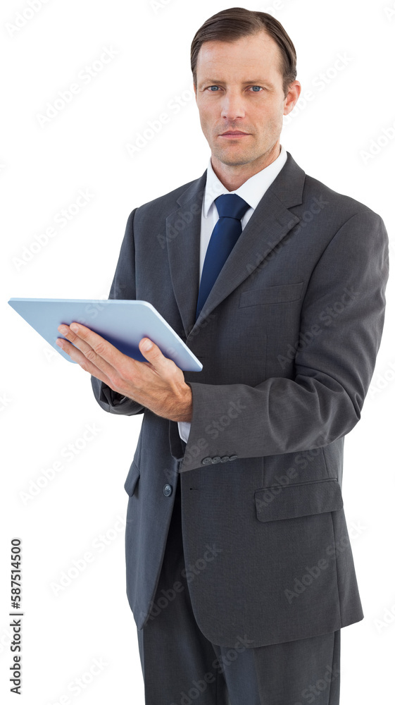 Serious charismatic businessman holding a tablet computer Serious charismatic businessman holding a tablet computer
