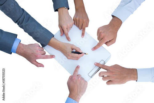 Businesswoman writing on clipboard while colleagues pointing on it