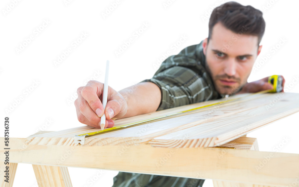 Worker marking on wooden plank Worker marking on wooden plank