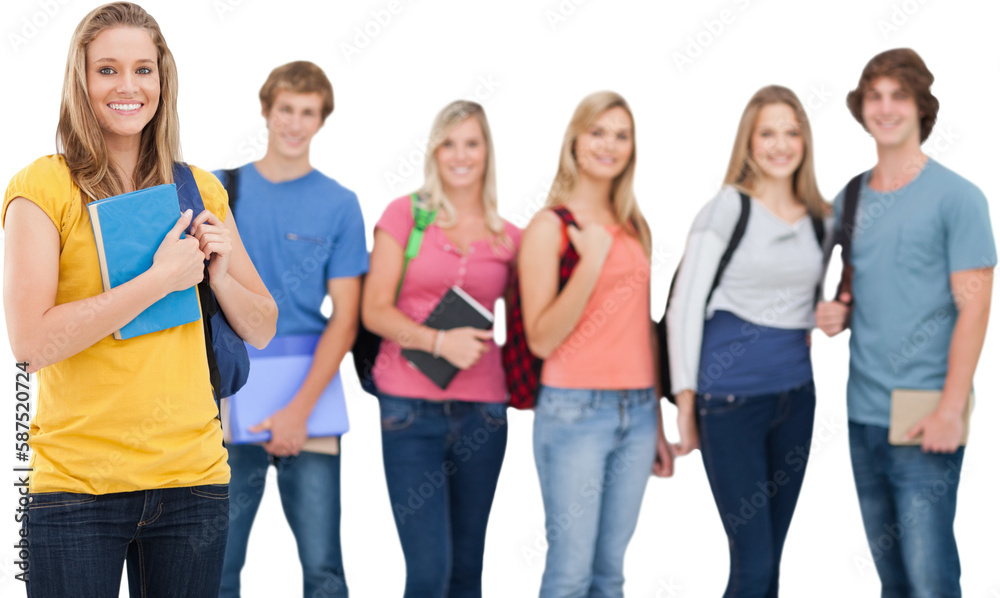 A group of college students standing as one girl stands in front of them A group of college students standing as one girl stands in front of them