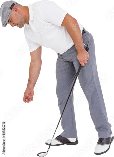 Golf player picking up golf ball