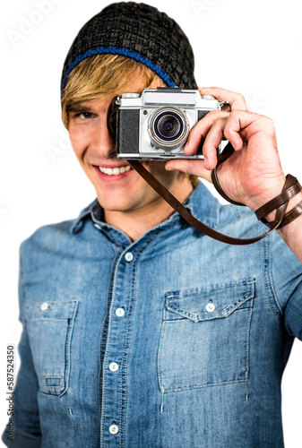 Smiling hipster man taking picture