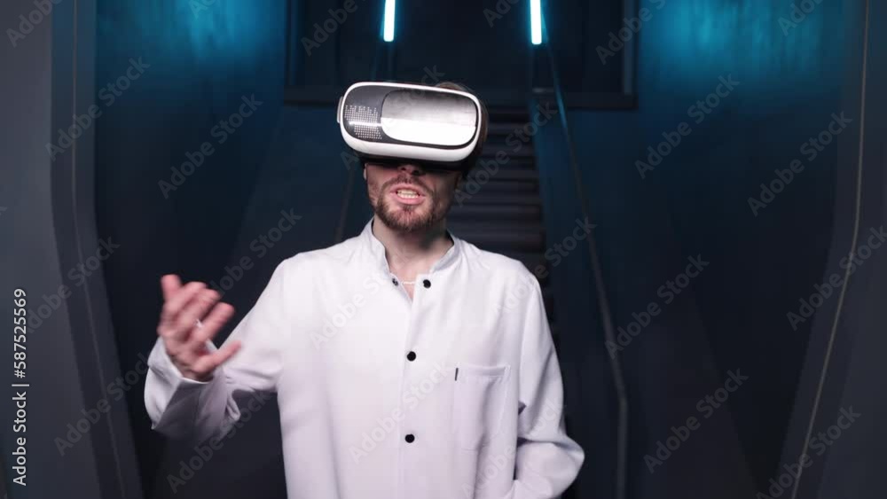 Smiling man gesturing while wearing VR headset. Portrait of technician developing new interactive program with augmented reality indoors. High quality 4k footage Smiling man gesturing while wearing VR headset. Portrait of technician developing new interactive program with augmented reality indoors. High quality 4k footage