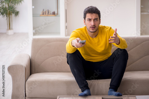 Young man sitting at home during pandemic