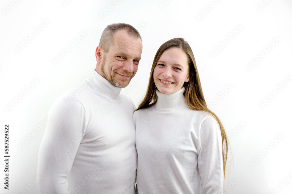 Portrait of smiling couple in white t-shirt in bedroom at home. High quality photo Portrait of smiling couple in white t-shirt in bedroom at home. High quality photo