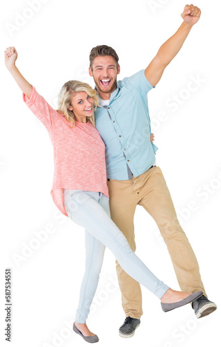 Attractive couple smiling and cheering