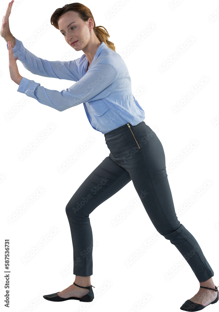 Obraz premium Businesswoman pretending to push an invisible wall