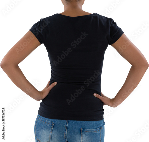 Mid section of young woman with hands on hip