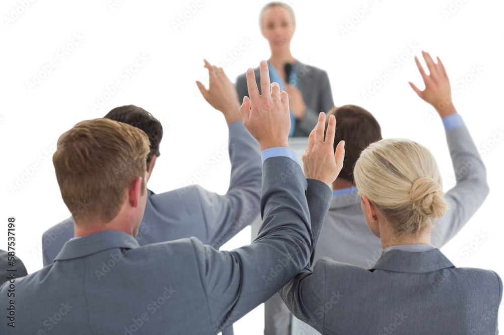 Business team raising hands during conference Business team raising hands during conference