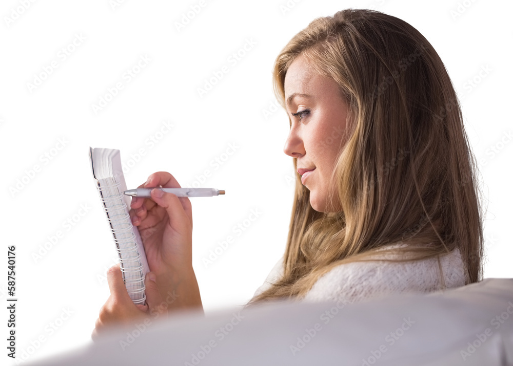 Pretty blonde relaxing on the couch writing in notepad Pretty blonde relaxing on the couch writing in notepad