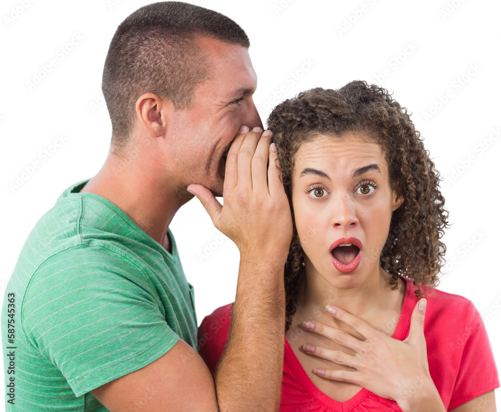 Businessman whispering secret into female colleague's ear Businessman whispering secret into female colleague's ear