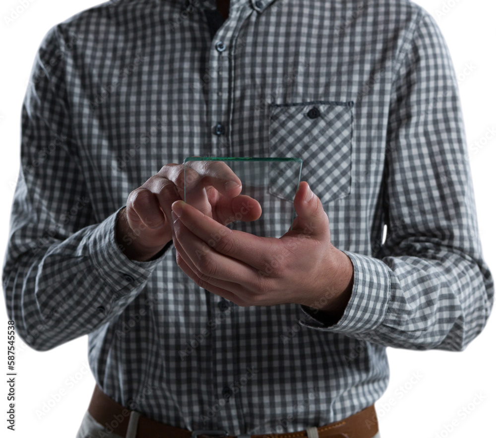 Fototapeta premium Mid-section of man using glass mobile phone