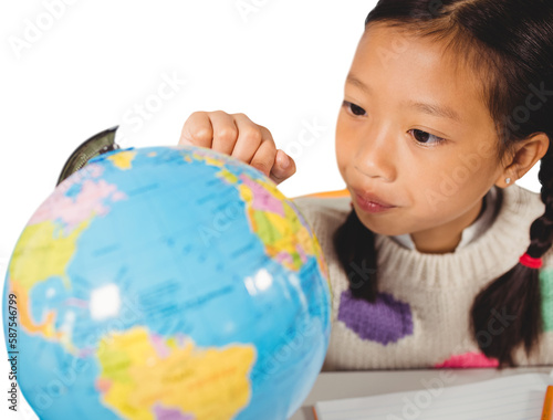 Student looking at globe