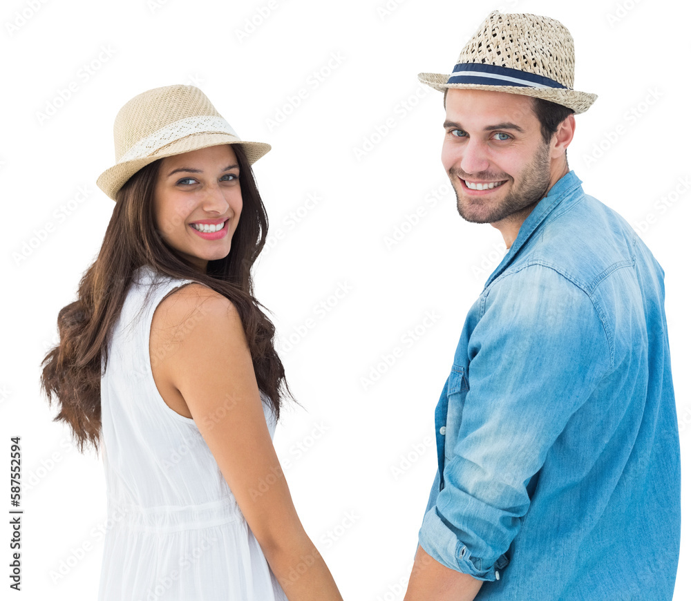 Happy hipster couple holding hands and smiling at camera Happy hipster couple holding hands and smiling at camera