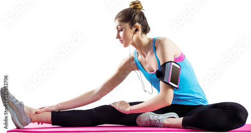 Sportswoman stretching on exercise mat
