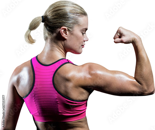 Muscular woman flexing her arm