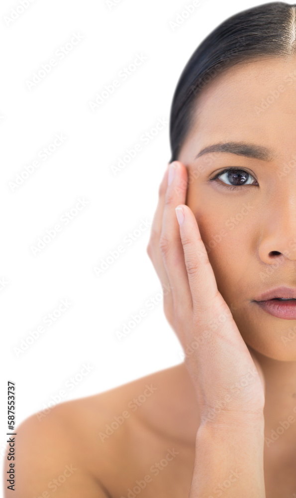 Half face of pensive natural model touching her cheek Half face of pensive natural model touching her cheek