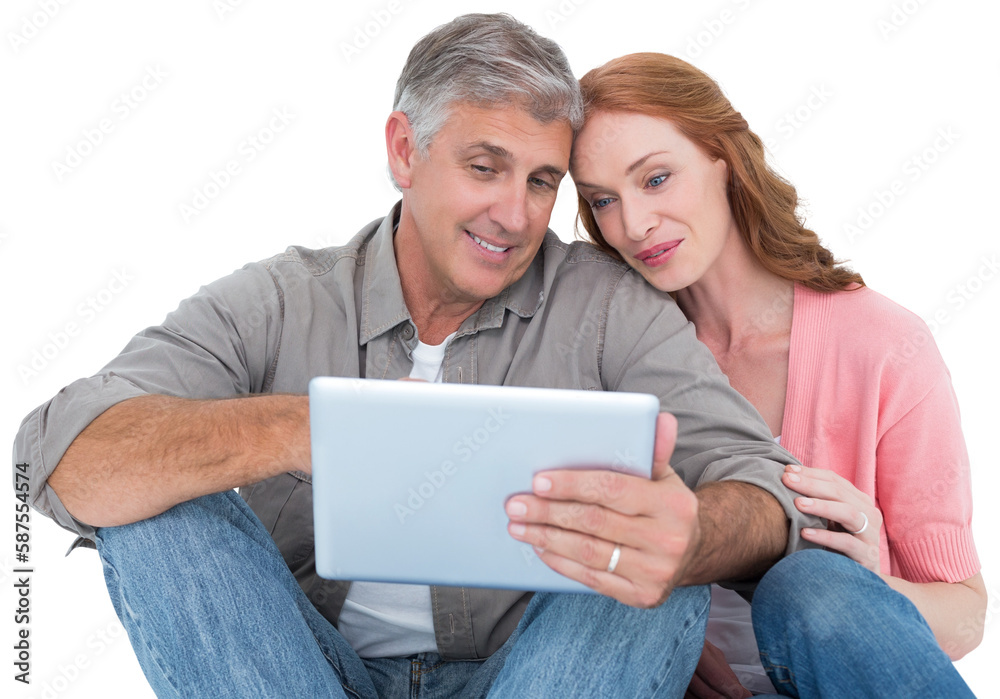 Casual couple sitting using tablet Casual couple sitting using tablet