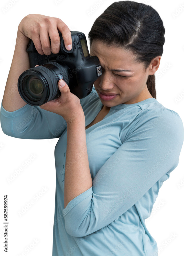 Concentrated female photographer photographing through digital camera Concentrated female photographer photographing through digital camera