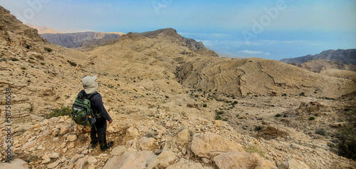 Trekking in the arid Eastern Hajar Mountains, Wadi Bani Khalid, Oman photo