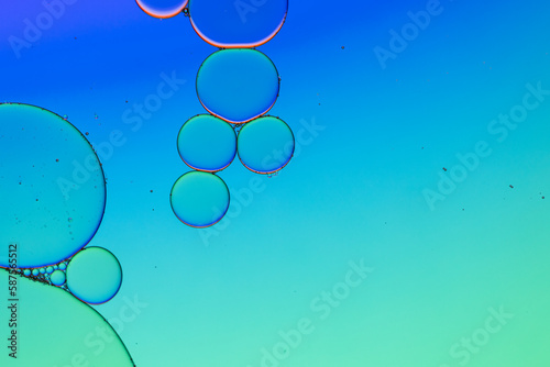 Macro close up of water bubbles with copy space over blue and green background