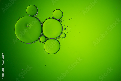 Macro close up of water bubbles with copy space over green background