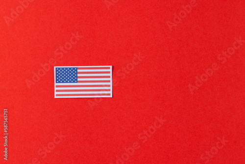 High angle view of flag of united states of america with copy space on red background © vectorfusionart