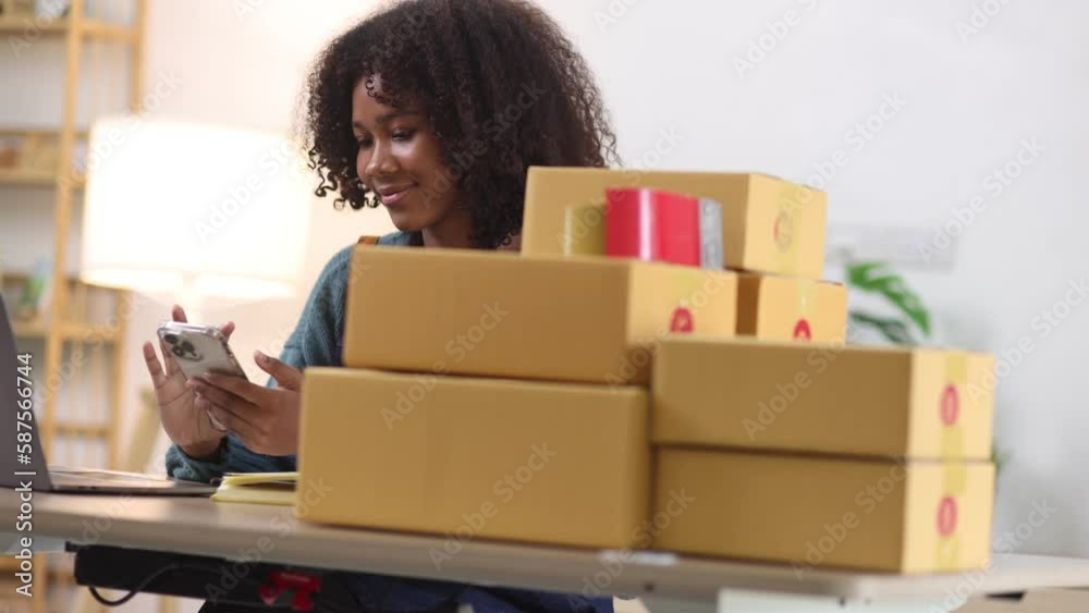 Young African American woman and online selling at home office, Startup small business owner working Online selling and product order for delivery to customer. Young African American woman and online selling at home office, Startup small business owner working Online selling and product order for delivery to customer.