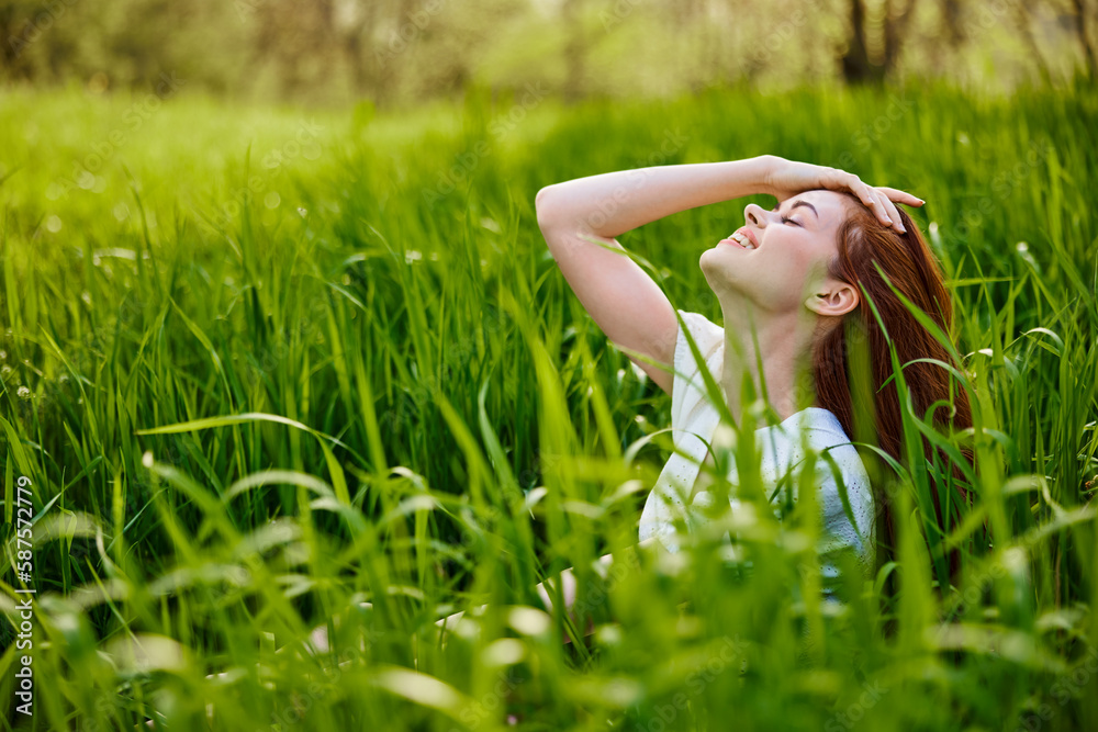 a red-haired woman stands in the tall grass, raising her oxen up and laughing widely with her teeth a red-haired woman stands in the tall grass, raising her oxen up and laughing widely with her teeth