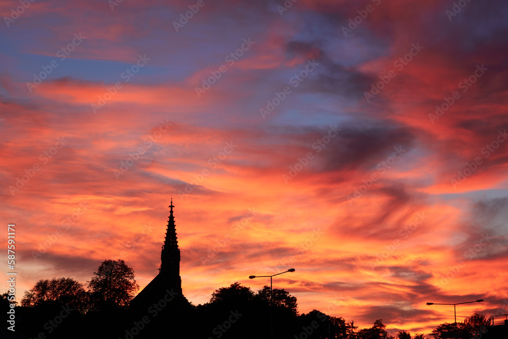 Silhouette of the berger church, beautiful orange evening sky, Stuttgart, Bad Cannstatt, Germany.