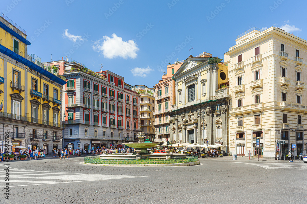 Naples, Italy. View of Piazza Trieste e Trento on a sunny August day. In the foreground, the so-called Artichoke Fountain. On the background the San Ferdinando Curch. 2022-08-20.