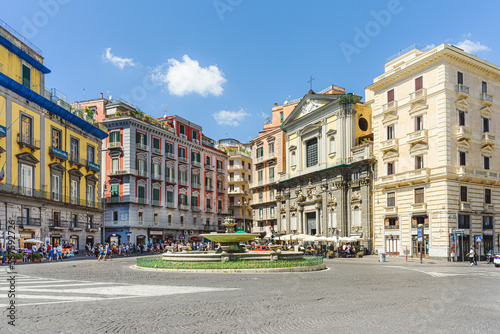 Naples, Italy. View of Piazza Trieste e Trento on a sunny August day. In the foreground, the so-called Artichoke Fountain. On the background the San Ferdinando Curch. 2022-08-20. photo