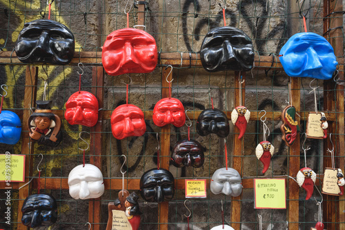 Naples, Italy. Some typical puffin masks of different colors, for sale on the street of the old town in Via San Gregorio Armeno. 2022-08-20.