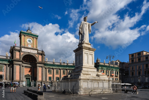 Naples, Italy. View of Piazza Dante with the Dante Alighieri's statue and the facade of the building of the ancient Convitto Nazionale Vittorio Emanuele School. 2022-08-20.