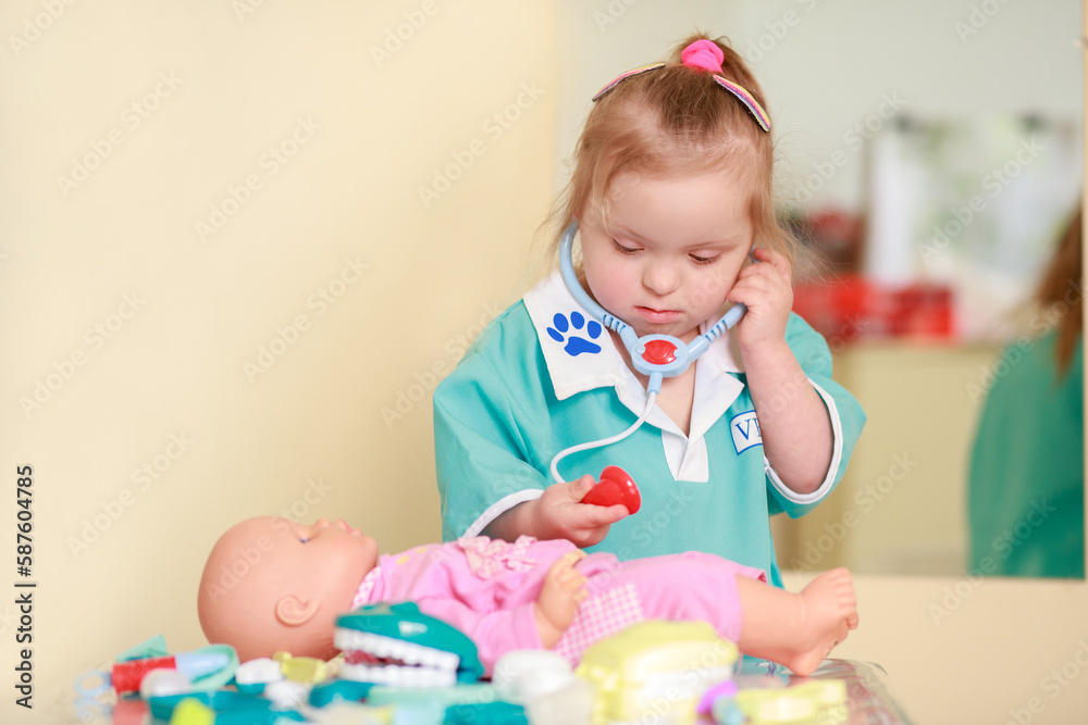 Girl with Down Syndrome in a blue robe. The child is playing. Strong emotional response.
Girl with Down Syndrome in a blue robe. The child is playing. Strong emotional response.