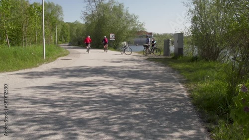 Wallpaper Mural cyclists driving on road in spring Torontodigital.ca