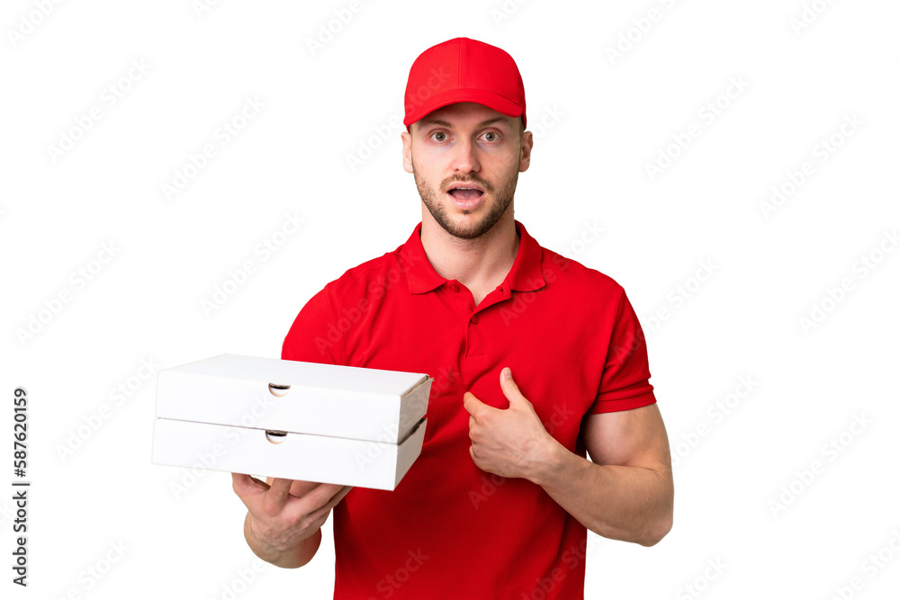 Pizza delivery man with work uniform picking up pizza boxes over isolated chroma key background with surprise facial expression Pizza delivery man with work uniform picking up pizza boxes over isolated chroma key background with surprise facial expression