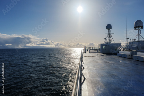 Scenic panoramic seascape view of Ocean and clouds on blue sky on sunny day at sea seen from outdoor deck of luxury cruiseship cruise ship liner