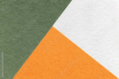 Texture of craft white, green and orange shade color paper background, macro. Vintage abstract olive cardboard