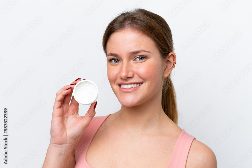 Young caucasian woman isolated on white background with moisturizer and happiness Young caucasian woman isolated on white background with moisturizer and happiness