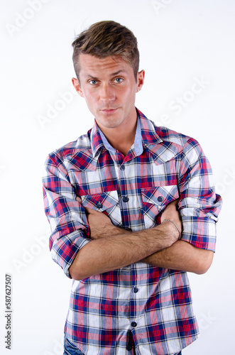 Young man posing in the studio.